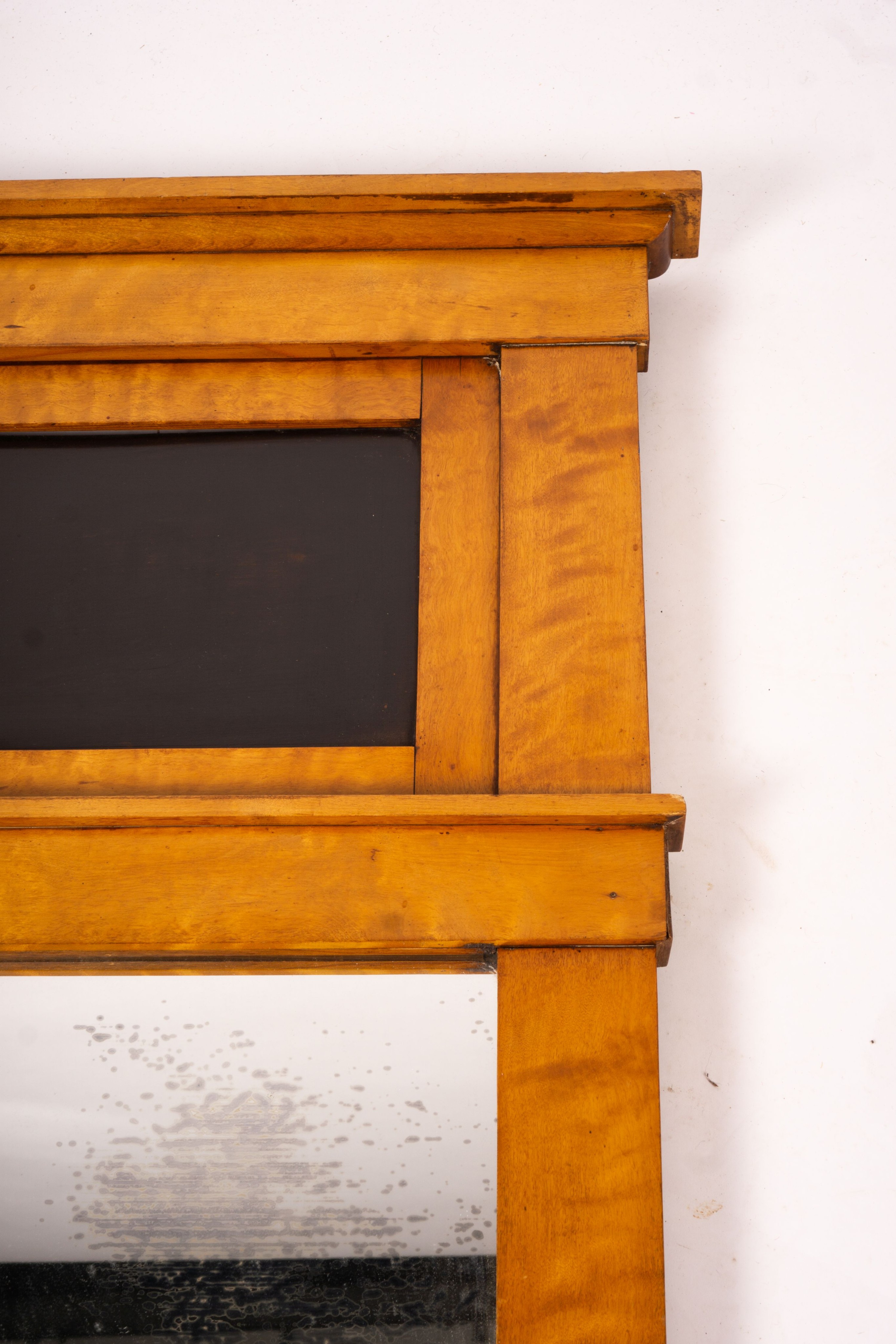 A Biedermeier style maple wall mirror, width 52cm, height 109cm